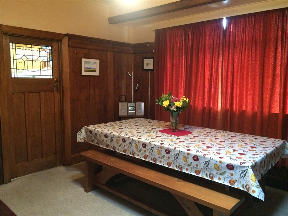 Dining room with 8 seat hand made Rimu table