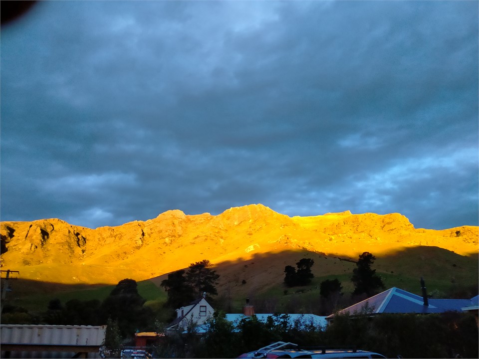 Amazing golden sun setting on craggy hills taken f