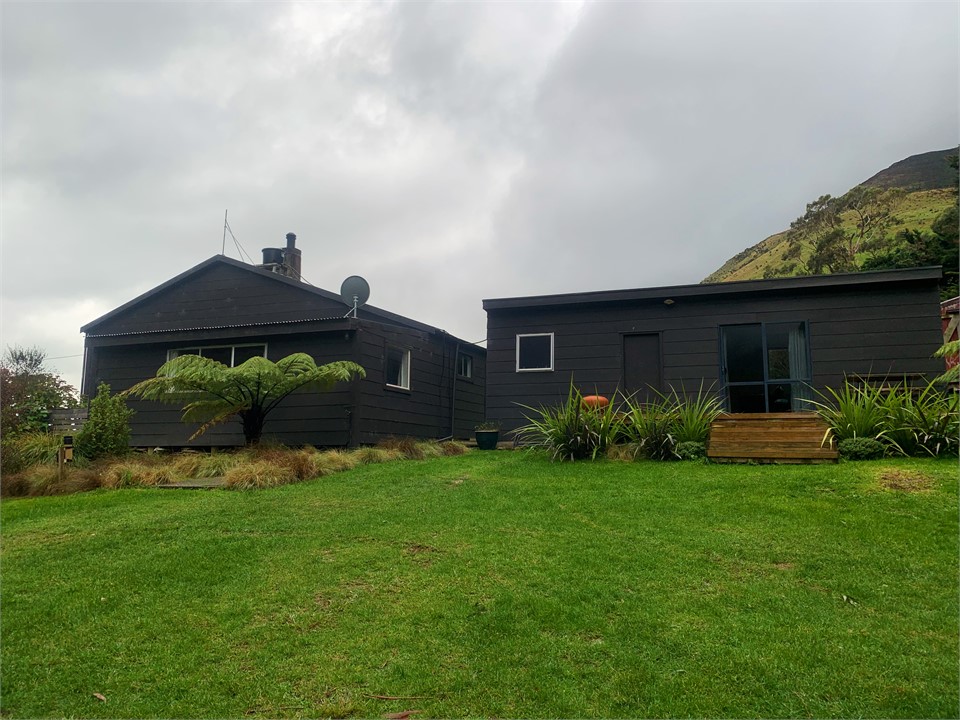 Kina Hut on the right next to Te Puka Bach