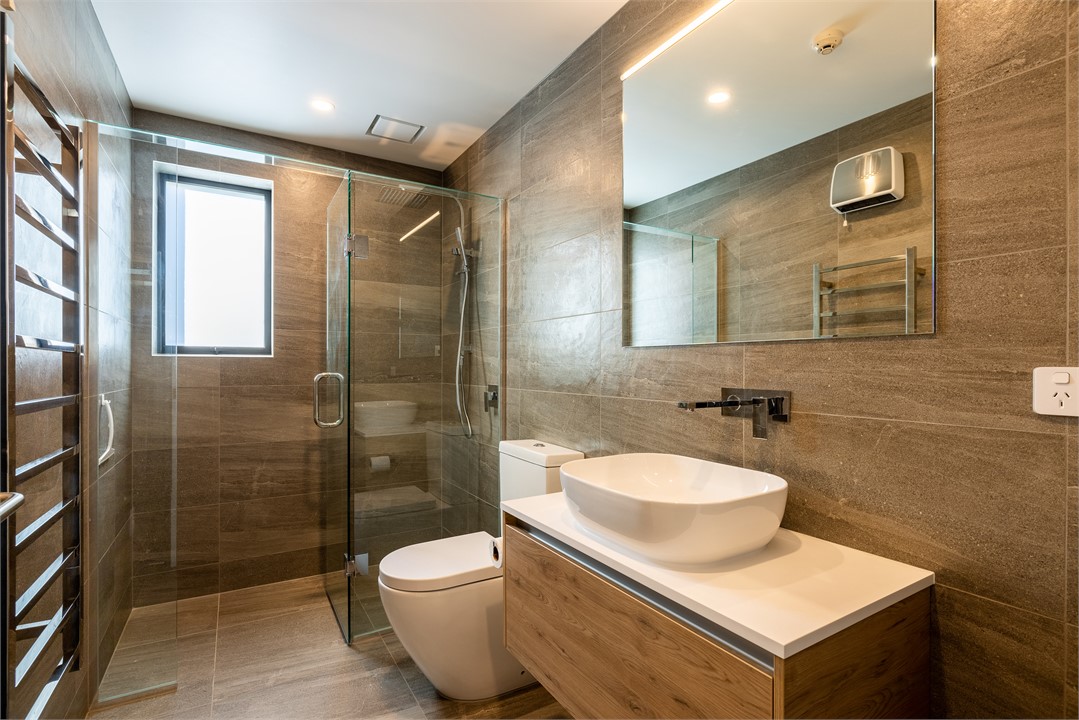 Bathroom 3 has a toilet and a shower