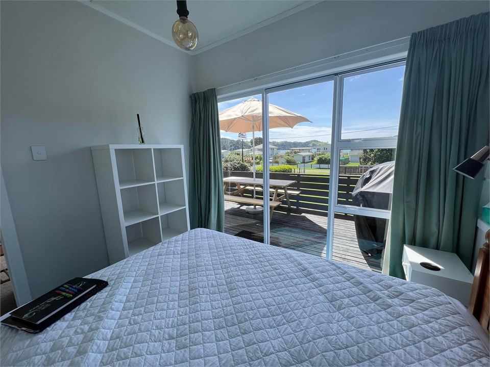 Main double bedroom showing sliding doors onto dec