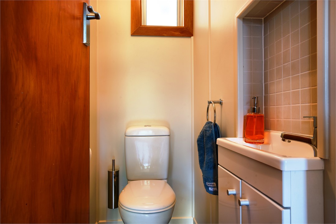 The second bathroom has a toilet and basin.