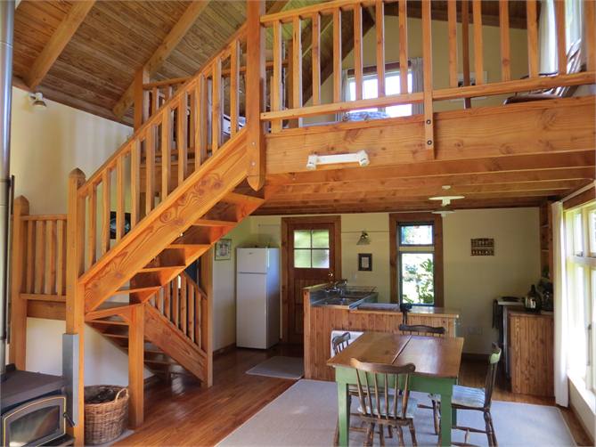 dining and kitchen with bedroom above