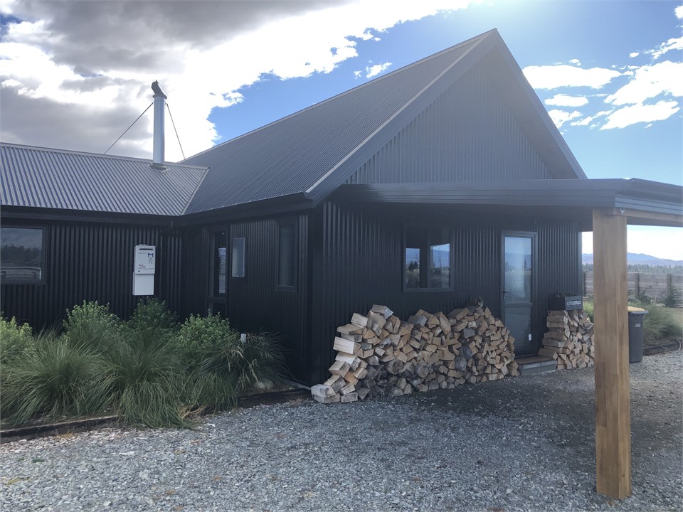Front door and covered carport for parking