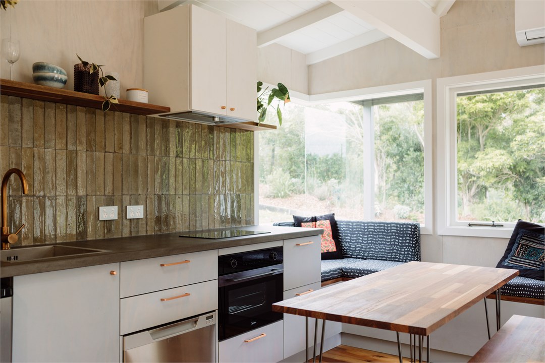 Open plan kitchen living area in cottage