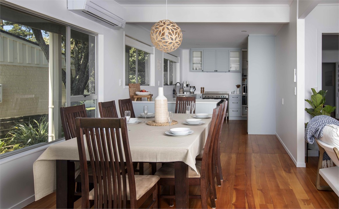Dining area with kitchen behind