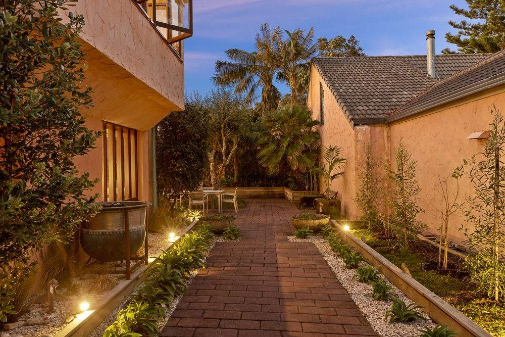 Private courtyard and entry is illuminated to 12pm