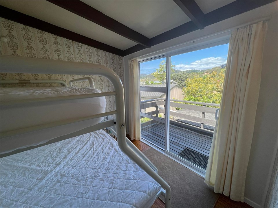 3rd bedroom off kitchen with direct access to deck