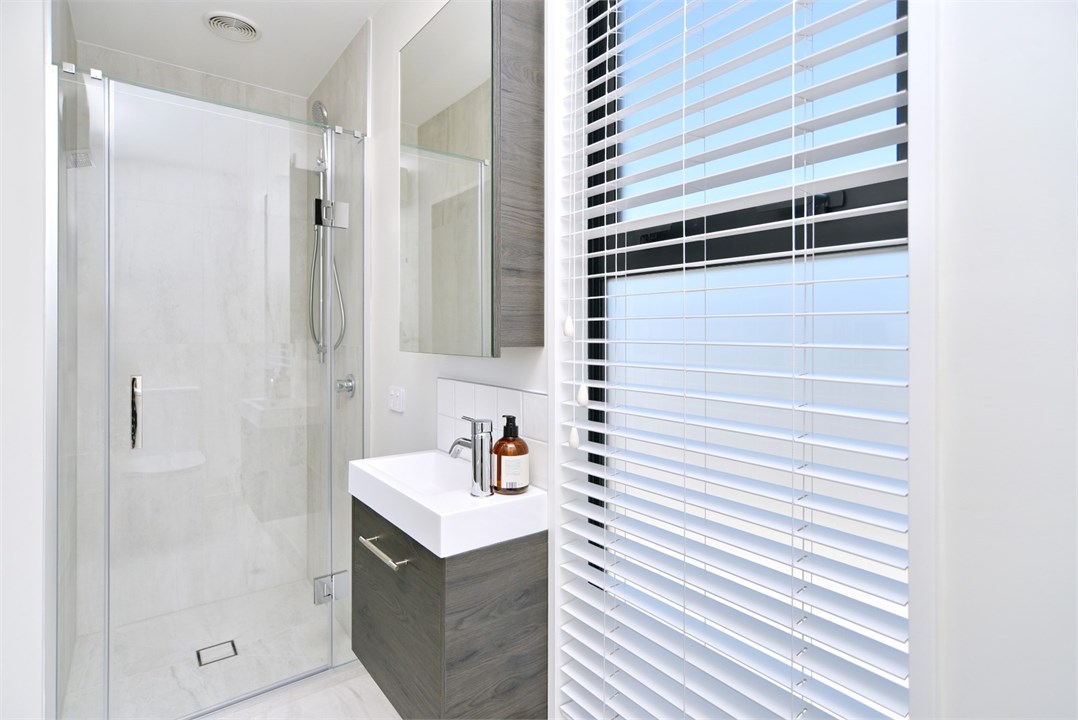 Bathroom 2 has a shower and a toilet