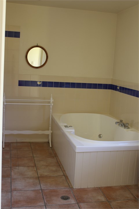 Bathroom with spa bath and separate shower
