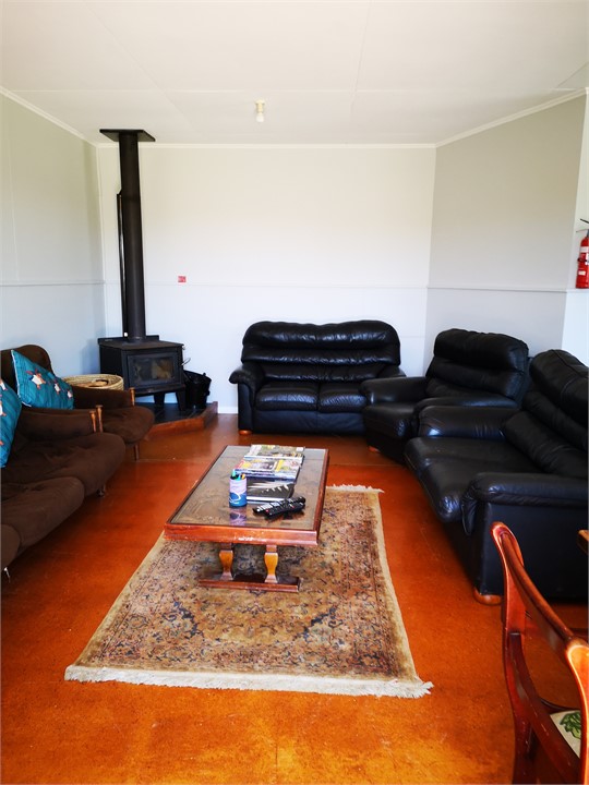 Cosy lounge with log burner.