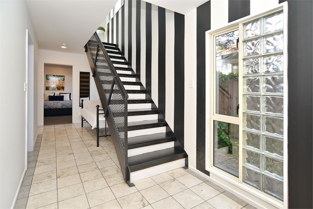 The central staircase greets you as you enter