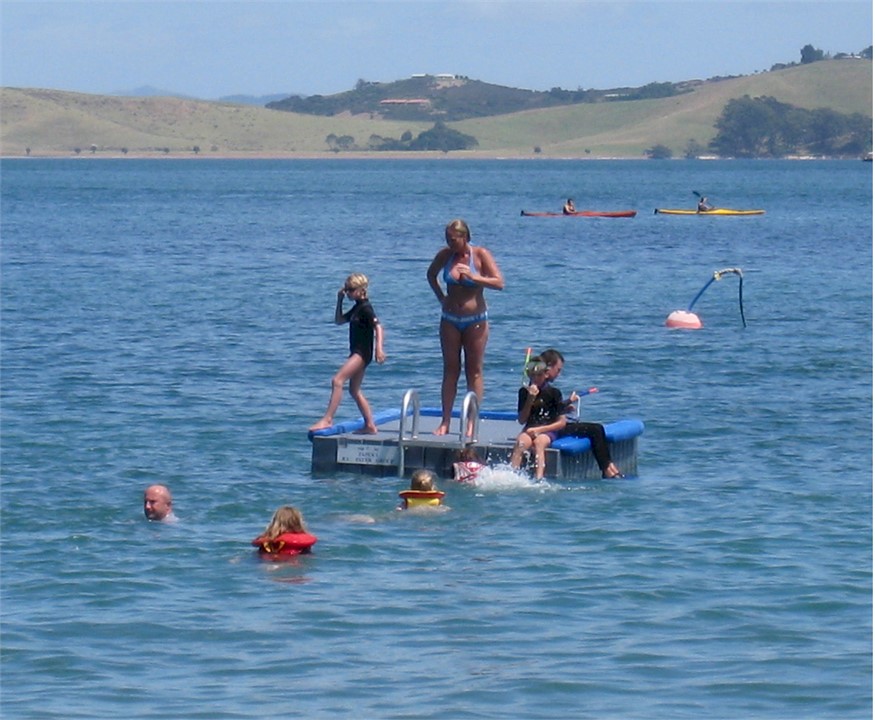 Family fun on the diving pontoon moored in front