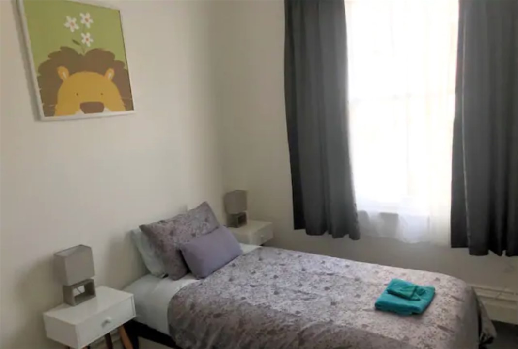 Second bedroom has a double bed and baby cot