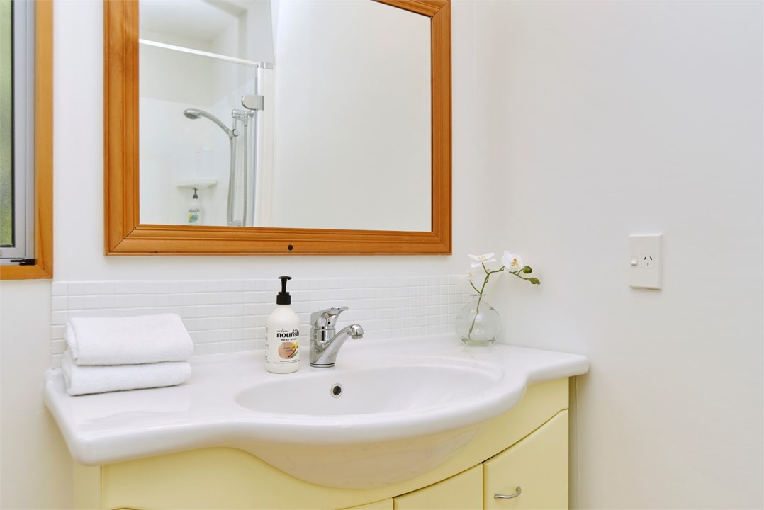 Bathroom 2 has a shower and a toilet