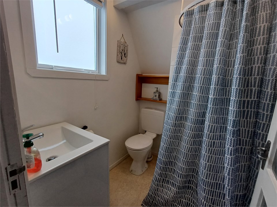 Downstairs bathroom. Adjacent to bedroom