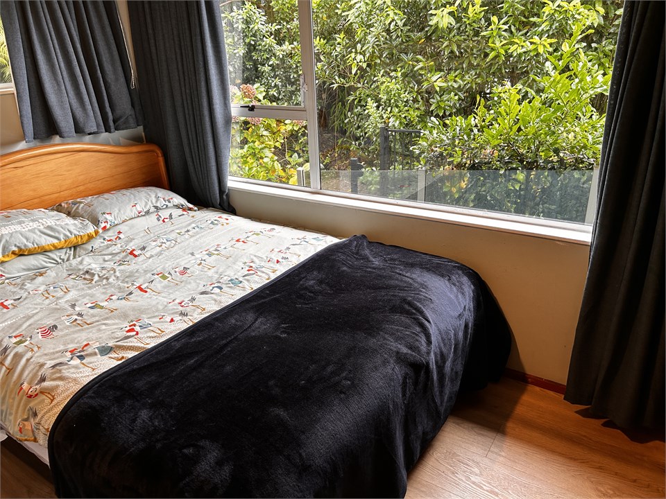 new queen bed in bedroom 2 with a view of the beac