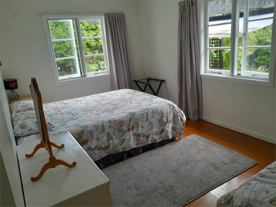 3rd Bedroom with Queen bed and single, views to ga