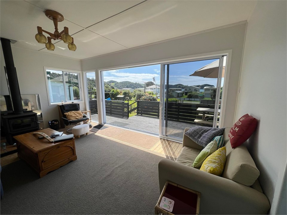 Living Room with double open doors access to deck
